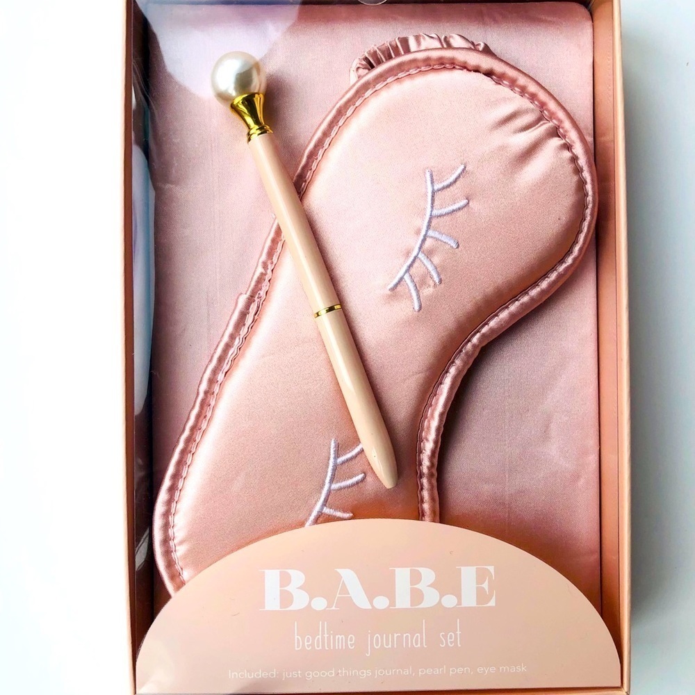Journal set in pink satin with pen and eye mask